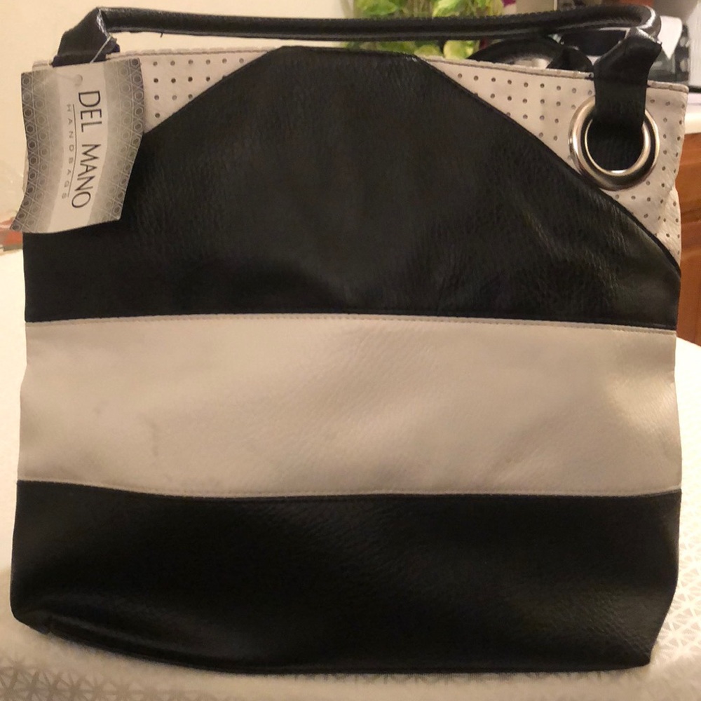 Brand new with original tag by del Mano never used